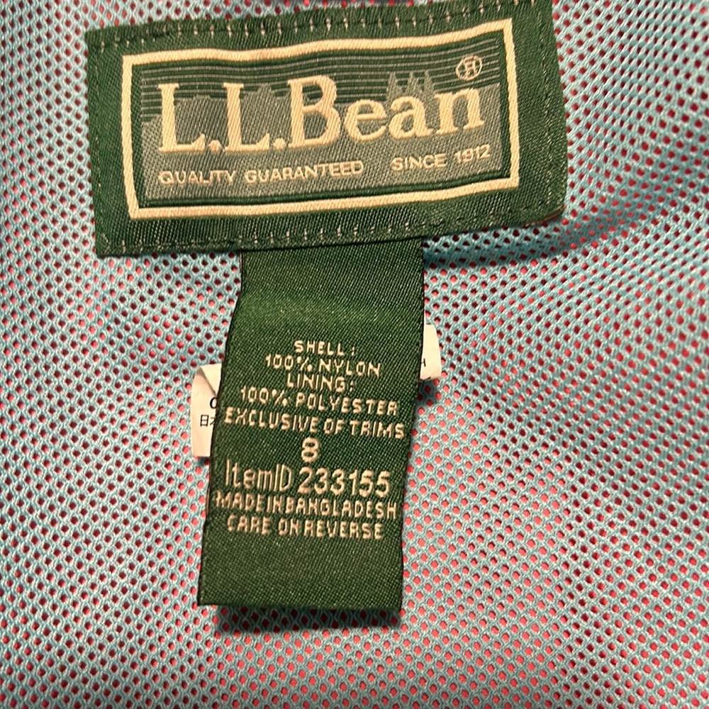 Girls size 8 L.L. Bean pink rain jacket with blue interior.